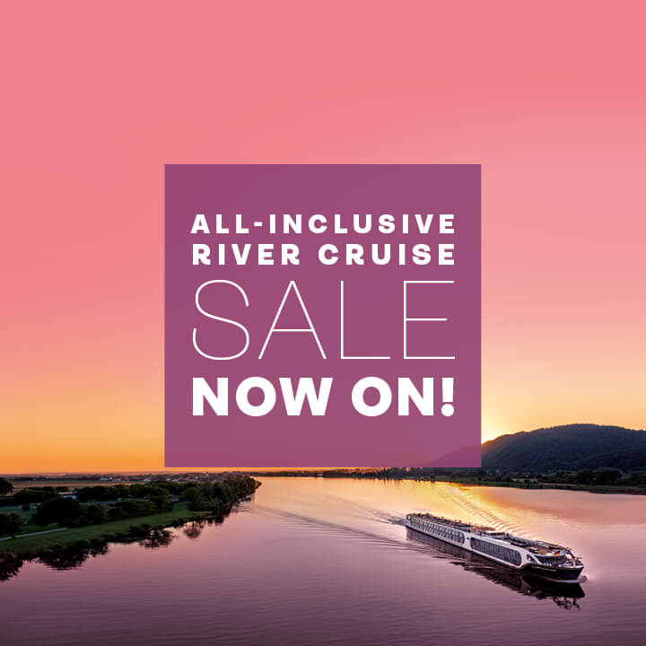 White 'all-inclusive river cruise sale now on' text in a purple square overlaid on an image of Spirit of the Danube sailing at sunset